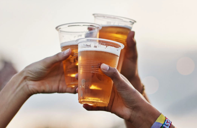 Three friends cheers their beers 
